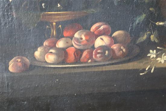17th century Flemish School Still life of flowers and fruit on a table top 42 x 63in.